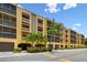 Low rise condominium building with covered parking and a tropically landscaped entrance at 5817 Park N St # 310, St Petersburg, FL 33709