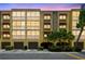 Beautiful condominium building with garage parking and mature, tropical landscaping at 5817 Park N St # 310, St Petersburg, FL 33709
