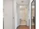 Hallway view showing bathroom, tile floors, and neutral colors at 5817 Park N St # 310, St Petersburg, FL 33709