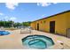 Outdoor hot tub with sun loungers and a view of the tennis court at 5817 Park N St # 310, St Petersburg, FL 33709
