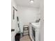 Laundry room featuring washer, dryer, and storage space at 5817 Park N St # 310, St Petersburg, FL 33709