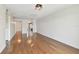 Welcoming living room with hardwood floors and a view of the kitchen and entryway at 5817 Park N St # 310, St Petersburg, FL 33709