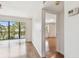 Living room offering access to an enclosed balcony with lake view at 5817 Park N St # 310, St Petersburg, FL 33709