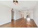 Cozy living room showcasing hardwood floors, ample closet space, and a view into the kitchen at 5817 Park N St # 310, St Petersburg, FL 33709