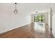 Spacious living room with hardwood floors and sliding glass doors to a balcony offering natural light at 5817 Park N St # 310, St Petersburg, FL 33709