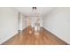 Inviting living room with hardwood floors and natural light, offering views of the kitchen at 5817 Park N St # 310, St Petersburg, FL 33709