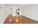Inviting living room with hardwood floors offering views to the kitchen and front door at 5817 Park N St # 310, St Petersburg, FL 33709