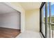 Bright living room with access to balcony and adjacent room at 5817 Park N St # 310, St Petersburg, FL 33709