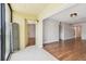 Open living room flows to balcony, featuring tile and wood flooring at 5817 Park N St # 310, St Petersburg, FL 33709