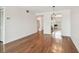 Comfortable living room with hardwood floors and views into the kitchen at 5817 Park N St # 310, St Petersburg, FL 33709