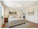 Staged main bedroom with hardwood floors and ensuite bathroom at 5817 Park N St # 310, St Petersburg, FL 33709