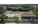 Aerial view showcasing pool and tennis court, offering residents recreational opportunities at 5817 Park N St # 310, St Petersburg, FL 33709