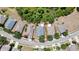 Aerial view of the property showcasing the house, backyard, and surrounding neighborhood at 5925 Sweet William Ter, Land O Lakes, FL 34639