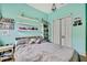 Bedroom featuring light blue painted walls, carpet floors, shelves and a double door closet at 5925 Sweet William Ter, Land O Lakes, FL 34639
