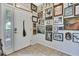 Cozy entryway featuring tiled floors and a wall adorned with various framed artworks, offering a unique welcome at 5925 Sweet William Ter, Land O Lakes, FL 34639