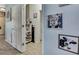 Hallway with neutral decor, art, and access to other rooms at 5925 Sweet William Ter, Land O Lakes, FL 34639