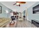 Bright living area connects to the dining and kitchen, offering an open floor plan and comfortable living space at 5925 Sweet William Ter, Land O Lakes, FL 34639