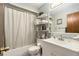 A bathroom with a white vanity and shower with a white curtain at 5960 Boyette Rd, Wesley Chapel, FL 33545