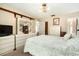 Bedroom with white furniture and a light colored floral comforter at 5960 Boyette Rd, Wesley Chapel, FL 33545