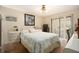 A bedroom with a queen bed and sliding door to the backyard at 5960 Boyette Rd, Wesley Chapel, FL 33545