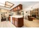 Open kitchen with a breakfast bar seamlessly connecting to the dining and living areas at 5960 Boyette Rd, Wesley Chapel, FL 33545