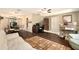 Inviting living room featuring dark wood floors, cozy furniture, and an open layout at 5960 Boyette Rd, Wesley Chapel, FL 33545