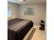 Cozy bedroom with tile floors, modern furnishings, and plenty of natural light at 6345 Lambert Ln, New Port Richey, FL 34652