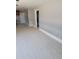 Bright living room features tile floors and fresh paint, creating a modern and airy space at 6345 Lambert Ln, New Port Richey, FL 34652