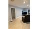 Open living room with tile floors, neutral paint, and plenty of space for relaxing at 6345 Lambert Ln, New Port Richey, FL 34652