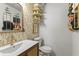 Stylish bathroom featuring modern fixtures, decorative wallpaper and ample storage space at 6370 1St N St # 202, St Petersburg, FL 33702