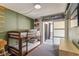 Comfortable bedroom featuring bunk beds, modern decor and an adjacent sitting area at 6370 1St N St # 202, St Petersburg, FL 33702