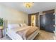 Cozy bedroom featuring a comfortable bed, modern lighting and en suite bathroom access at 6370 1St N St # 202, St Petersburg, FL 33702