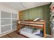 Charming bedroom with bunk beds, unique wall decor and ample storage at 6370 1St N St # 202, St Petersburg, FL 33702