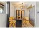 Contemporary dining area with unique table, rattan chairs, and stylish divider at 6370 1St N St # 202, St Petersburg, FL 33702