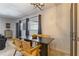 Inviting dining area with modern table, stylish chairs, and contemporary lighting fixture at 6370 1St N St # 202, St Petersburg, FL 33702