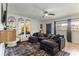 Stylish living room featuring a large sectional sofa, modern TV console, and elegant decor at 6370 1St N St # 202, St Petersburg, FL 33702