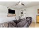 Relaxing living room with a comfortable couch, modern TV console, and decorative arched mirrors at 6370 1St N St # 202, St Petersburg, FL 33702