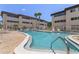 Sparkling community pool offers a refreshing escape with ample lounging space and palm tree accents at 6370 1St N St # 202, St Petersburg, FL 33702