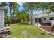 Expansive backyard featuring lush greenery and a wooden fence, offering privacy and plenty of space at 6618 12Th N St, St Petersburg, FL 33702
