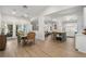 Open concept dining area flowing into the living room and kitchen, filled with natural light at 6618 12Th N St, St Petersburg, FL 33702