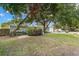 Charming single-story home with mature trees, providing shade and curb appeal at 6618 12Th N St, St Petersburg, FL 33702