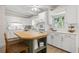 Modern kitchen with white cabinets, a wood-topped island, and stainless steel appliances at 6618 12Th N St, St Petersburg, FL 33702