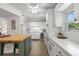 Bright kitchen featuring white cabinetry, a butcher block island, and stainless steel appliances at 6618 12Th N St, St Petersburg, FL 33702