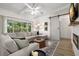 Cozy living room with a sectional sofa, patterned rug, and a sliding barn door at 6618 12Th N St, St Petersburg, FL 33702