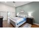 Charming bedroom with decorative rug, wood flooring, and elegant furnishings at 6618 12Th N St, St Petersburg, FL 33702