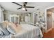 Cozy bedroom includes a ceiling fan, a closet, and a view of the hallway at 7523 Pitch Pine Cir # 184, Tampa, FL 33617