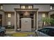 Beige two-story condo complex with covered entrance and limited parking; updated exterior and landscaping at 7523 Pitch Pine Cir # 184, Tampa, FL 33617