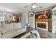 Inviting living room with a ceiling fan, wood floors, and access to the dining area at 7523 Pitch Pine Cir # 184, Tampa, FL 33617