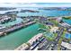 Beautiful aerial view of waterfront condos, a marina, and lush green spaces with surrounding water views at 7625 Sun Island S Dr # 304, South Pasadena, FL 33707