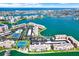 Panoramic aerial view of the waterfront complex featuring tennis courts, pools, and boating access at 7625 Sun Island S Dr # 304, South Pasadena, FL 33707